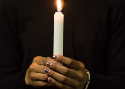 So we lit a candle: Gallery installation, 2018 4- 20 x 30 in. archival digital pigment prints, shelves and battery-operated tea light candles, 96 x 144 in. (dimensions vary)